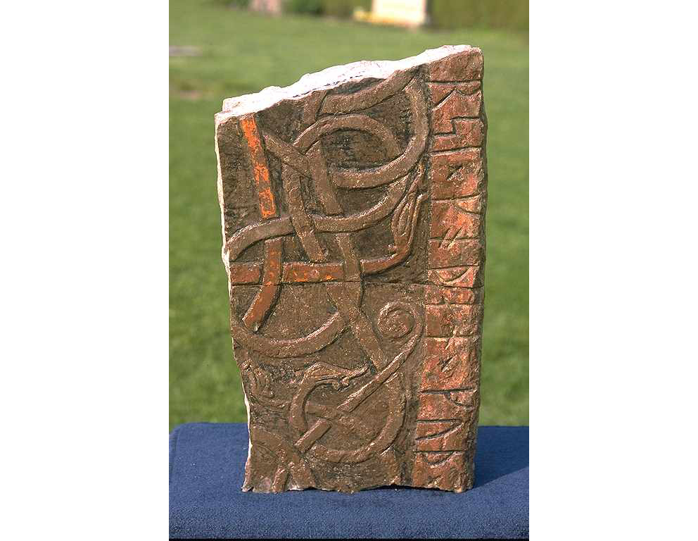 Original paint remaining on a carved runestone fragment from Köpings church, Öland